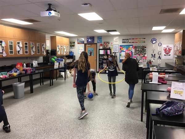 Students play a relay game